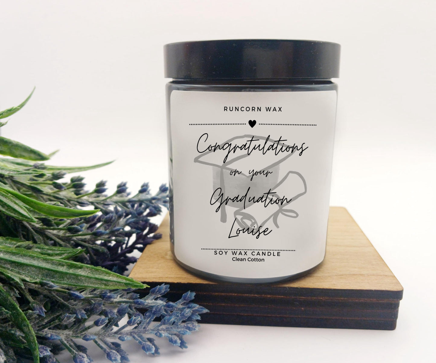 Candle with a personalized message on a white background graduation