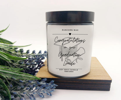Candle with a personalized message on a white background graduation