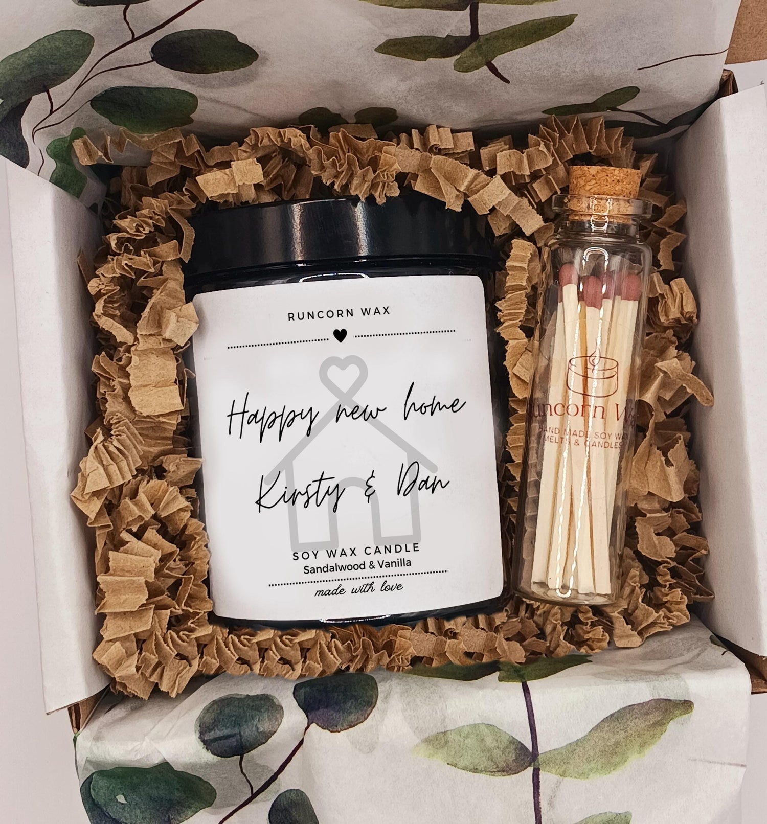 Candle and matches set with 'Happy new home' message in a decorative box.