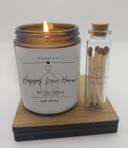 Soy wax candle with a bottle of matches on a wooden coaster