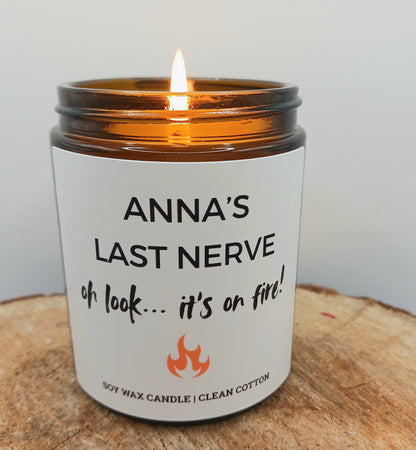 Candle with a humorous label and a small bottle of matches in the background funny last nerve on fire candle gift friend birthday present