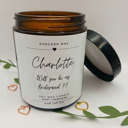 Candle jar with 'Will you be my Bridesmaid?' message on a white background