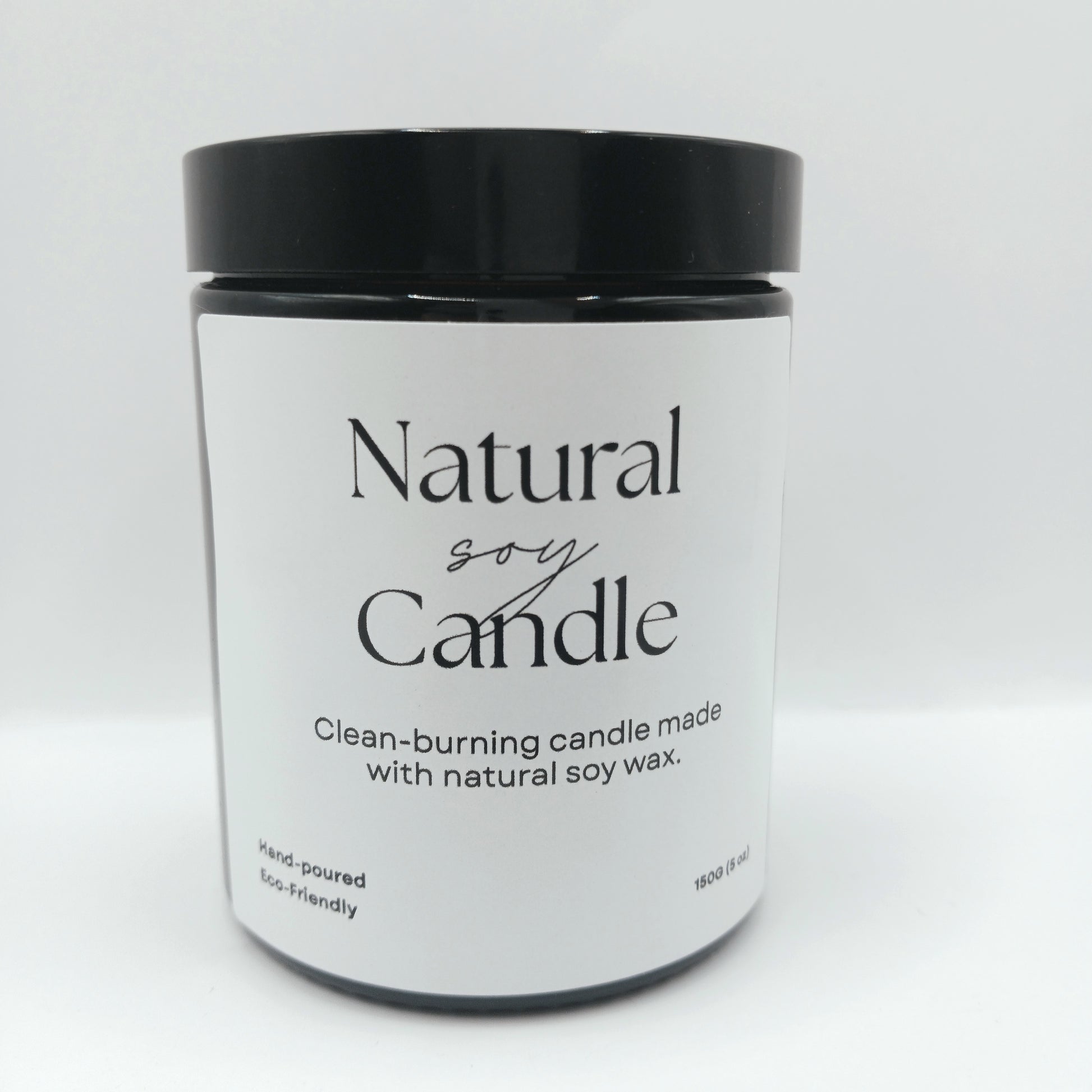 Jar of natural soy candle with black lid on a white background