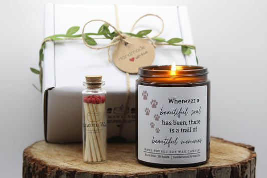 Candle with a quote and matches on a wooden surface pet bereavement memorial