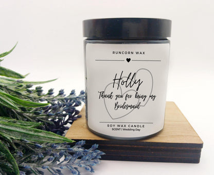 Candle with personalized message on a white background bridesmaid thank you