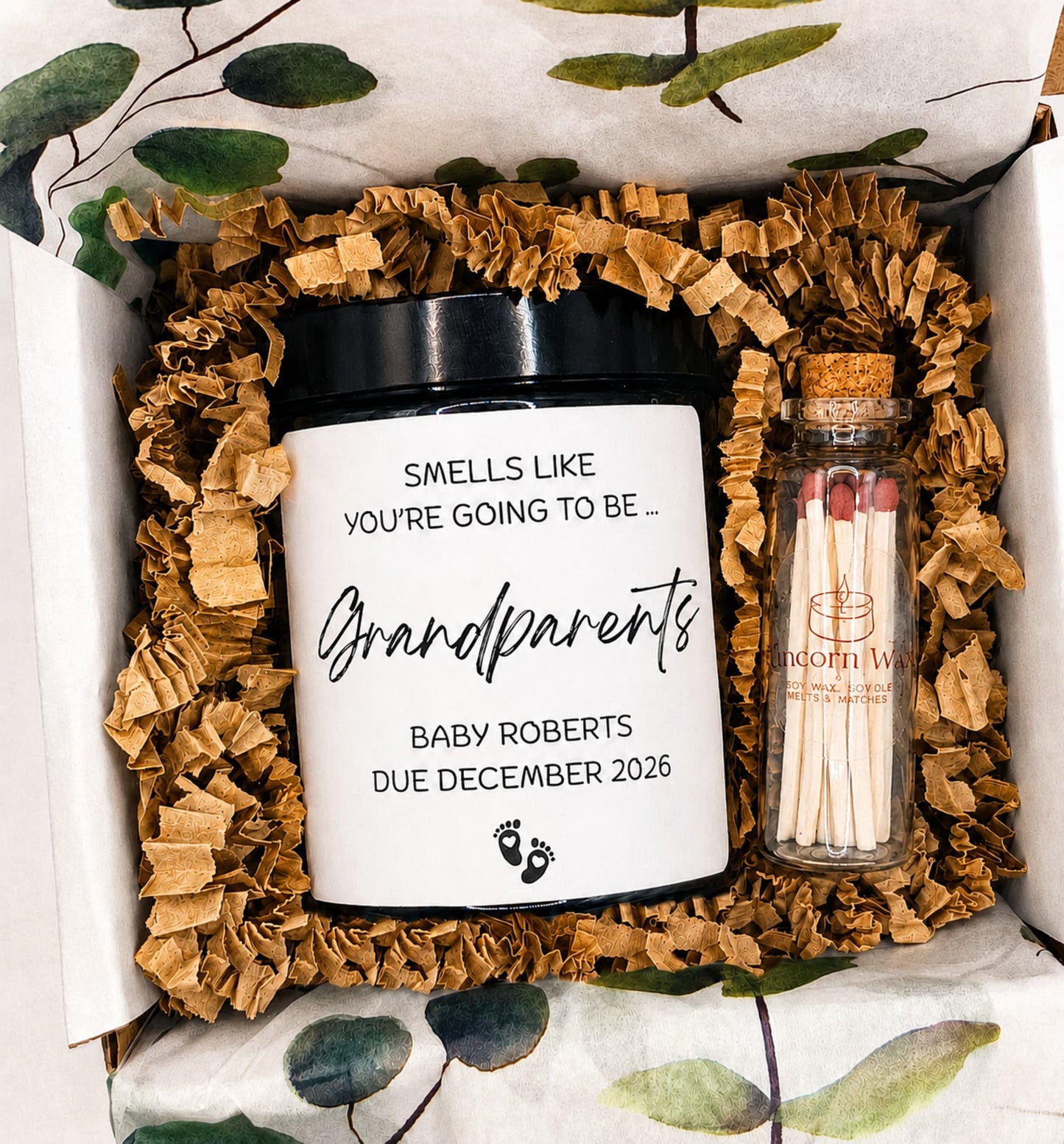 Personalised auntie pregnancy announcement candle in amber glass jar, in a candle gift box with eco friendly filling and jar of matches. eucalyptus themed tissue paper present 