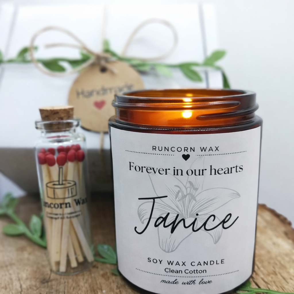 Candle with 'Runcorn Wax' branding and a small bottle of matches on a wooden surface. bereavement loss remembrance keepsake death family thoughtful