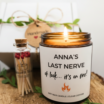 Candle with a humorous label and a small bottle of matches in the background funny last nerve on fire candle gift friend birthday present