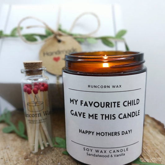 mothers day candle gift set from runcorn wax featuring label my favourite child gave me this candle,  love with matches and decorative present Candle with a label on a wooden surface, accompanied by a small bottle and matches.