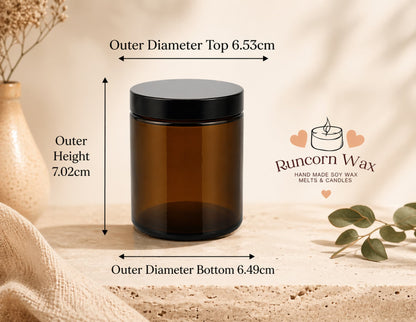 Amber glass jar with black lid placed on a textured surface, with labelled dimensions for height and diameter, styled with soft neutral decor and Runcorn Wax branding
