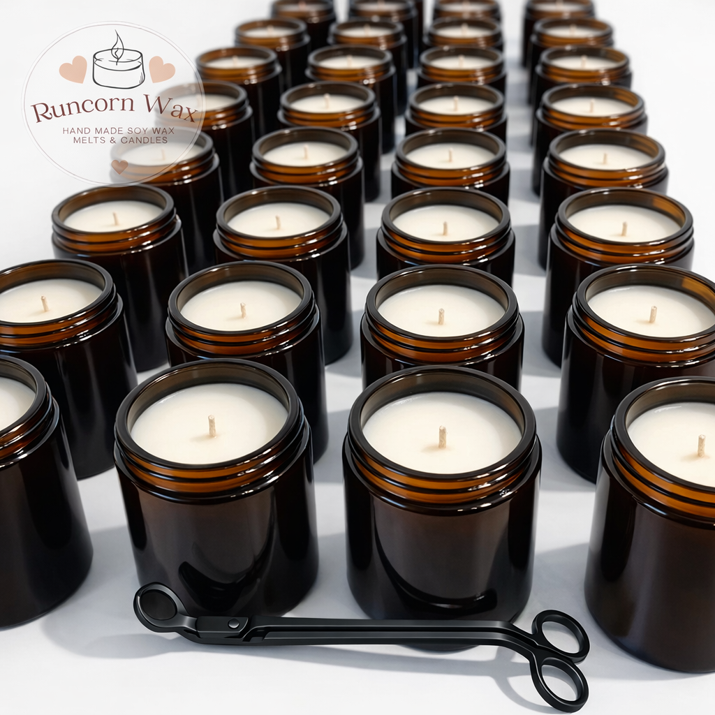 Multiple amber candle holders with white candles on a white surface, featuring the Runcorn Wax logo.